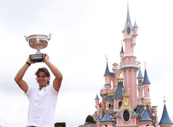 (110606) -- PARIS, June 6, 2011 (Xinhua) -- Rafael Nadal of Spain poses for photos at Disneyland Resort in Marne-la-Vallee outside Paris, capital of France, June 6, 2011. Nadal defeated Roger Federer of Switzerland in their men s final at the French Open tennis tournament on Sunday. (Xinhua Gao Jing) FRANCE-PARIS-NADAL-DISNEYLAND 