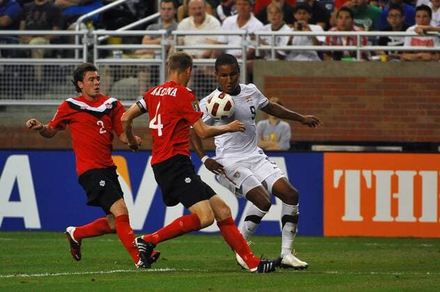 June 7, 2011 - Detroit, MI United States defender Oguchi Onyewu (5) and Canada defender Kevin McKenna (4) go after this through ball in the first half of the CONCACAF Gold Cup First Round game on Tuesday evening at Ford Field, Detroit, Michigan. USA v Canada SOCCER: JUN 07 CONCACAF Gold Cup - First Round - USA v Canada Icon2581106070007 EDITORIAL USE ONLY
