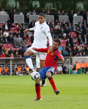 Spains Juan Mata tussles with Englands Chris Smalling UEFA U21 2011 Championship Group B Spain U21 v England U21 12th June, 2011 EDITORIAL USE ONLY. No use with unauthorised audio, video, data, fixture lists, club league logos or live services. Online in-match use limited to 120 images, no video emulation. No use in betting, games or single club league player publications.