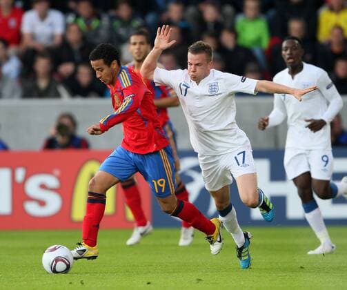 Spains Thiago Alcantara tussles with Englands Tom Cleverley UEFA U21 2011 Championship Group B Spain U21 v England U21 12th June, 2011 EDITORIAL USE ONLY. No use with unauthorised audio, video, data, fixture lists, club league logos or live services. Online in-match use limited to 120 images, no video emulation. No use in betting, games or single club league player publications.