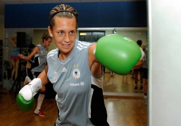 FRANKFURT AM MAIN, GERMANY - JUNE 13: Lena Goessling of German National Football Team is boxing during a Germany training session at Fitness First club on June 13, 2011 in Frankfurt am Main, Germany - 