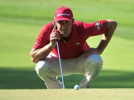 Dustin Johnson lines up a putt on the 4th green during a practice round prior to the U.S. Open at Congressional Country Club in Bethesda, Maryland on June 14, 2011.  WAP20110614317