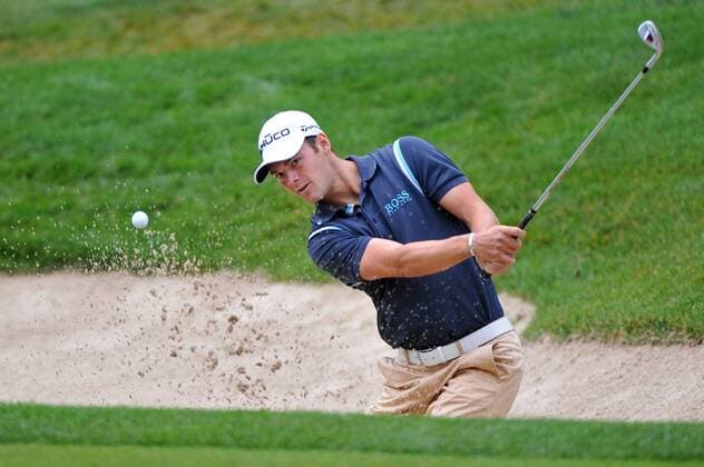 Martin Kaymer of Germany hits out of a bunker on the 11th hole during round one of the U.S. Open at Congressional Country Club in Bethesda, Maryland on June 16, 2011.  WAP20110616302