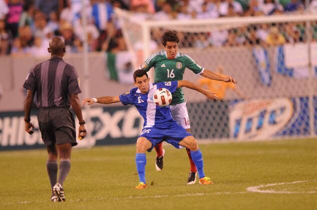 June 18, 2011 - East Rutherford, New Jersey, U.S - Guatemala s Marco Pappa (blue) controls the ball away from Mexico s Efrain Juarez (green) during first half CONCACAF Gold Cup soccer quarterfinal action between Mexico and Guatemala at the New Meadowlands Stadium in East Rutherford, N.J. Guatemala leads 1-0 at half time. CONCACAF Gold Cup Soccer - June 18 - Mexico vs Guatemala - ZUMAx50