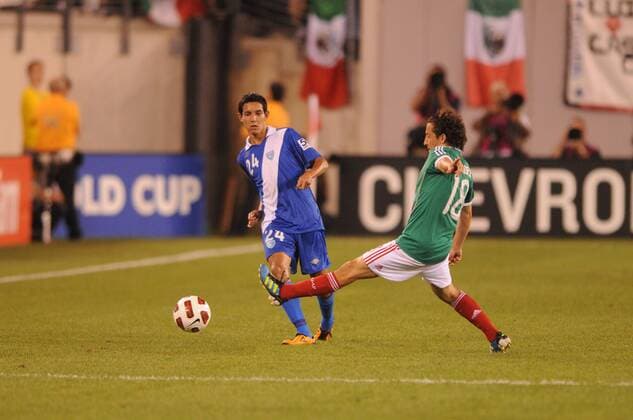 June 18, 2011 - East Rutherford, New Jersey, U.S - Mexico s Andres Guardado (18) plays the ball away from Guatemala s Jonathan Lopez (24) during second half CONCACAF Gold Cup soccer quarterfinal action where Mexico defeated Guatemala 2-1 at the New Meadowlands Stadium in East Rutherford, N.J. CONCACAF Gold Cup Soccer - June 18 - Mexico vs Guatemala - ZUMAx50