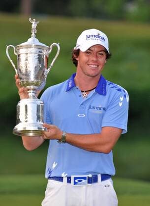 Northern Ireland s Rory McIlroy holds up the trophy after winning the U.S. Open Championship at Congressional Country Club in Bethesda, Maryland on June 19, 2011. McIlroy shot 2-under-par for 69 to finishing the tournament 16-under at 268, setting a new U.S. Open record.  WAP20110619331