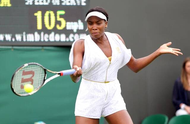 American Venus Williams returns the ball in her match on the opening day of the 125th Wimbledon Championships in Wimbledon,London on Monday June 20 2011.  LON2011062025