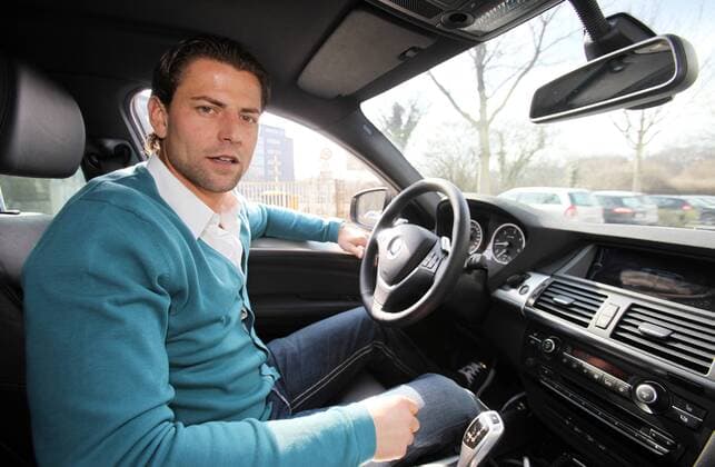 Dienstag 23.03.2010, 1. Bundesliga Saison 09 10 - Dortmund, BV Borussia Dortmund, Torwart Roman Weidenfeller (BVB) mit seinem Wagen , Auto, BMW, PKW, Fahrzeug , DeFodi018