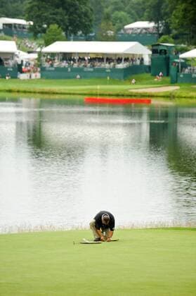 June 24, 2011 - Cromwell, Connecticut, U.S - A TPC River Highlands grounds crew member marks out the pin location for Saturday s third round before second round action started at the Travelers Championship on Friday. PGA Golf Herren 2011 - Jun 24 - Travelers Championship Second Round - ZUMAq39