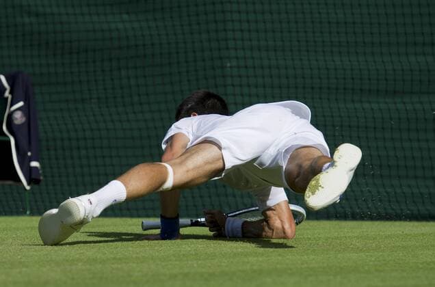 25.06.2011. Wimbledon, London. Novak Djokovic SRB (2). Novak falls in action. The Wimbledon Tennis Championships held at The All England Lawn Tennis and Croquet Club. xDuncanxGrovex  ActionPlus11187143 Content restricted for UK based newspaper