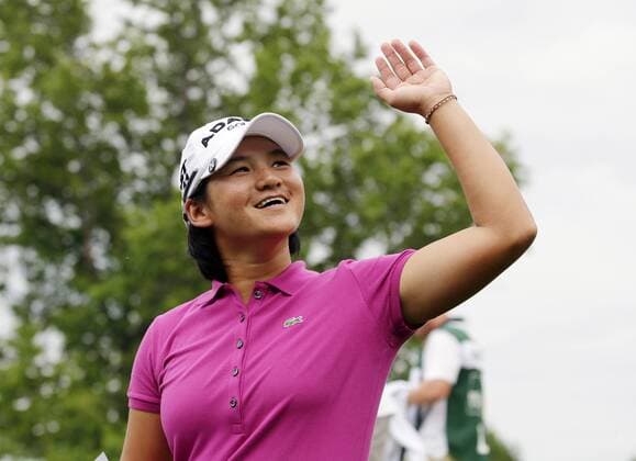 Yani Tseng of Taiwan reacts as she walks off of the 18th green in the final round of the Wegmans LPGA Golf Damen Championship at Locust Hill Country Club in Rochester, New York on June 26, 2011. Yani Tseng wins the Tournament with a score of 19 under par.  NYP20110626137