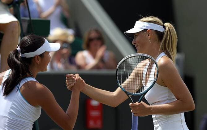 LONDON, June 27, 2011 -- Maria Sharapova (R) of Russia shakes hands with Peng Shuai of China after their women s singles fourth round match at the 2011 Wimbledon tennis championships in London, England, June 27, 2011. 