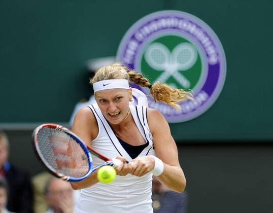 LONDON, June 30, 2011 -- Petra Kvitova of the Czech Republic hits a return during her semifinal match in 2011 s Wimbledon Tennis Championships in London, Great Britain, June 30, 2011. 