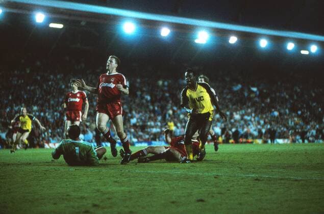 Michael Thomas (Arsenal) scores his title winning goal, past Steve Nicol and goalkeeper Bruce Grobbelaar. Arsenal v Liverpool; Anfield; 26 05 1989 Football  o0 FC London