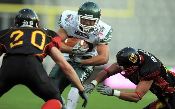 AMERICAN FOOTBALL - IFAF WM 2011, GER vs MEX INNSBRUCK,AUSTRIA,08.JUL.11 - DIVERS, AMERICAN FOOTBALL - IFAF Weltmeisterschaft, Länderspiel, Deutschland vs Mexiko. Bild zeigt Falk Horn (GER) und einen Spieler von MEX. 
