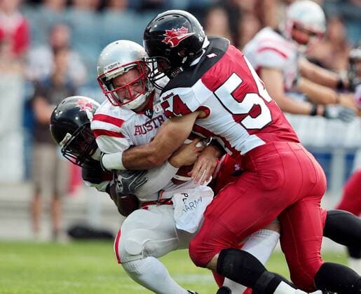 AMERICAN FOOTBALL - IFAF WM 2011, CAN vs AUT GRAZ,AUSTRIA,11.JUL.11 - DIVERS, AMERICAN FOOTBALL - IFAF Weltmeisterschaft, Länderspiel, Kanada vs Österreich. Bild zeigt Carter Thaine (CAN), Chris Gross (AUT) und Maggiacomo Anthony (CAN). 
