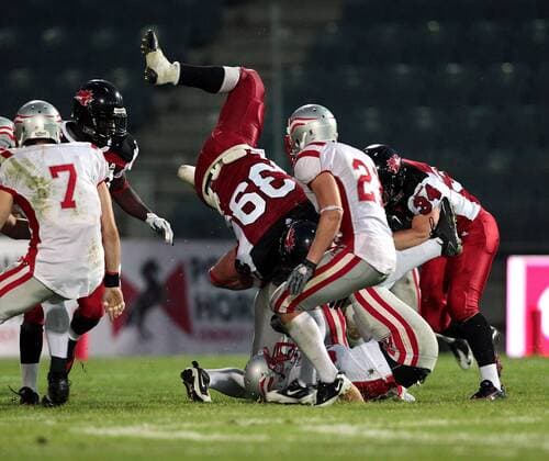 AMERICAN FOOTBALL - IFAF WM 2011, CAN vs AUT GRAZ,AUSTRIA,11.JUL.11 - DIVERS, AMERICAN FOOTBALL - IFAF Weltmeisterschaft, Länderspiel, Kanada vs Österreich. Bild zeigt Michel-Pierre Pontbriand (CAN) und Markus Krause (AUT). 