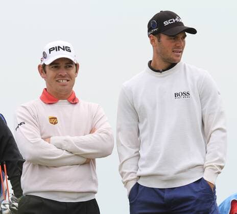 Germany s Martin Kaymer (L) and last year s Open winner Louis Oosthuizen at practice day in the 140th Open Championship at Royal St Georges Golf club in Sandwich,England on Tuesday, July 12, 2011.  LON2011071213