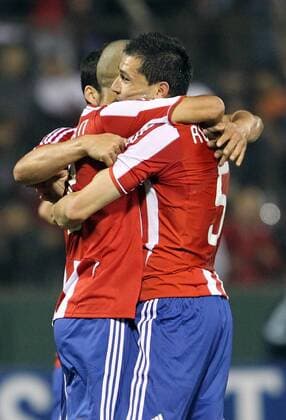 Paraguay s player Antolin Alcaraz (R) celebrates with his teammates during the match for the group stage of Copa America 2011 against Paraguay in Salta 