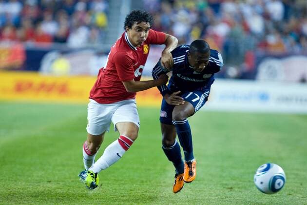 July 13, 2011: Manchester United defender Rafael Da Silva (21) and New England Revolution midfielder Sainey Nyassi (17) battle for the ball during the World Football Challenge game between Manchester United and New England Revolution at Gillette Stadium in Foxborough, Massachusetts. Manchester defeated the Revolution 4-1. SOCCER 2011: World Football Challenge - Manchester United (ManU) vs Revolution JUL 13 - ZUMAc04