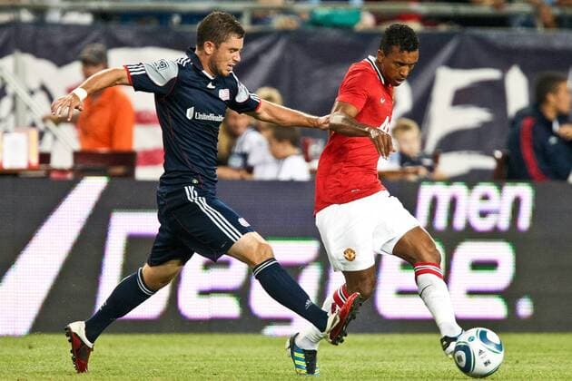 July 13, 2011 - Foxborough, Massachuestts, U.S - New England Revolution defender midfielder Chris Tierney (8) runs in to defend against a shot on goal by Manchester United midfielder Nani (17) in the first half of the match. Manchester United defeated the New England Revolution 4 - 1. MLS Fussball Herren USA 2011- July 13 - New England Revolution vs Manchester United - ZUMAx25
