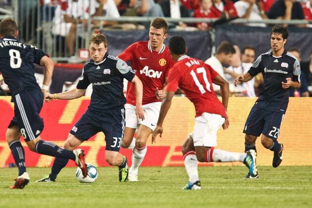 July 13, 2011 - Foxborough, Massachuestts, U.S - New England Revolution midfielder Zak Boggs (33) moves the ball past Manchester United midfielder Nani (17) during the first half of the match. Manchester United defeated the New England Revolution 4 - 1. MLS Fussball Herren USA 2011- July 13 - New England Revolution vs Manchester United - ZUMAx25
