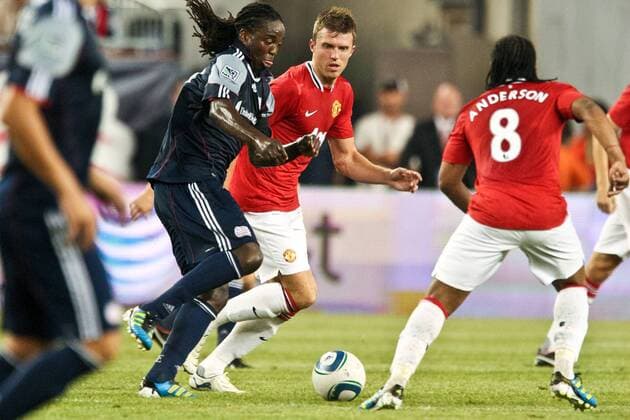 July 13, 2011 - Foxborough, Massachuestts, U.S - New England Revolution midfielder Shalrie Joseph (21) moves the ball past Manchester United defenders during the first half of the match. Manchester United defeated the New England Revolution 4 - 1. MLS Fussball Herren USA 2011- July 13 - New England Revolution vs Manchester United - ZUMAx25