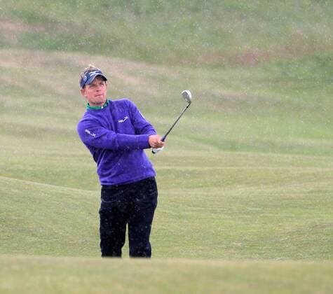 Englands Luke Donald plays a fairway iron on the 6th hole on the first day of the 140th Open Championship at Royal St Georges Golf club in Sandwich, England on Thursday, July 14, 2011.  LON2011071410