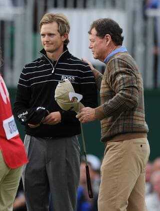 Golf - The Open 2011 - Royal St George s Tom Watson (USA) congratulates Tom Lewis (GBR) for his 5 under round of 65 at Royal St George s, Sandwich 