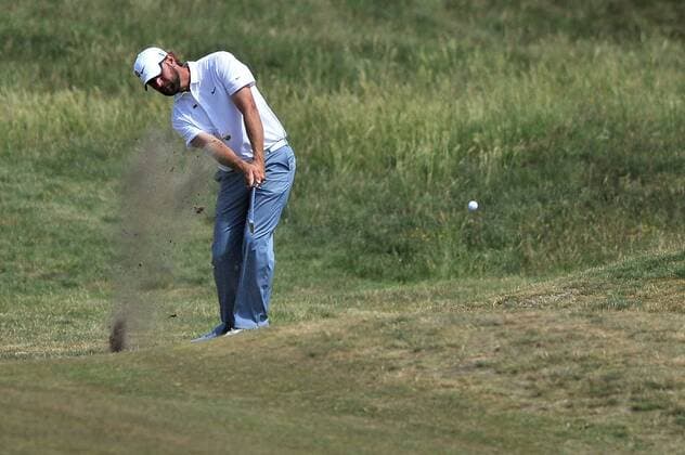 Golf - The Open 2011 - Royal St George s - Day 2 Lucas Glover (USA) plays out of the rough on the 17th at Royal St George s, Sandwich 