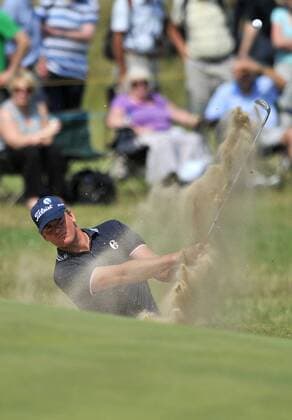 Golf - The Open 2011 - Royal St George s - Day 2 Robert Karlsson (SWE) chips out of a bunker onto the 17th green at Royal St George s, Sandwich 