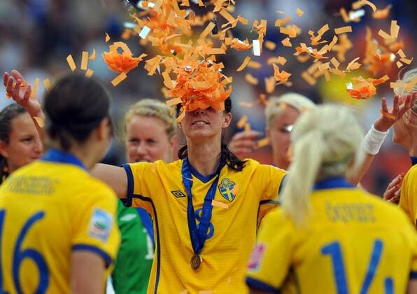 (110716) -- SINSHEIM, July 16, 2011 -- Sweden s Lotta Schelin celebrates their victory during the awarding ceremony of the third place final match between Sweden and France at the 2011 FIFA Women s World Cup in Sinsheim, Germany, July 16, 2011.  o0 Konfetti kurios Komik