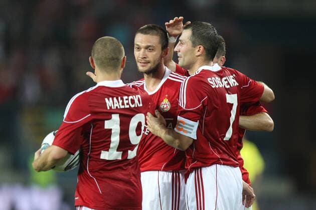 UEFA CHAMPIONS LEAGUE QUALIFICATIONS SECOND ROUND SECOND GAME WISLA KRAKOW - SKONTO RIGA - PATRYK MALECKI (L), IVICA ILIEV, RADOSLAW SOBOLEWSKI (R) - Celebration -  20110719CSLG0122