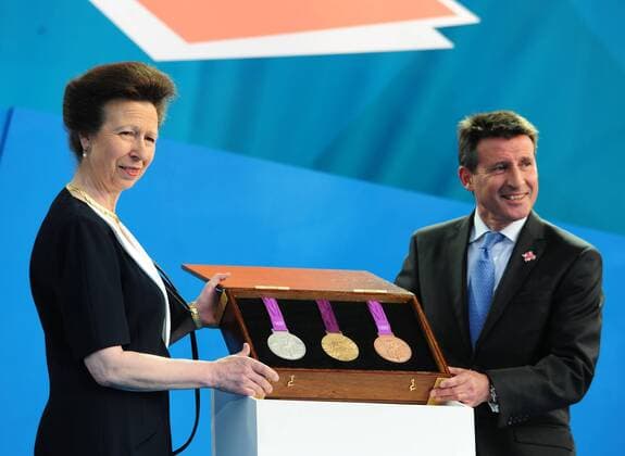 London Organising Committee for the Olympic Games (LOCOG) chairman Sebastian Coe (R) and Princess Anne display the medals at the London 2012 - One Year To Go celebration at Trafalgar Square in central London, Britain, July 27, 2011. London celebrated the one year countdown to the London 2012 Olympic games here on Wednesday, during which the medals were displayed to the public for the first time. ( Zeng Yi) UK-LONDON 2012 OLYMPICS-ONE YEAR COUNTDOWN-MEDALS 