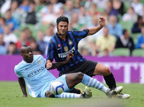 Mario Balotelli of Manchester City challenges Cristian Chivu of Inter Milan Dublin Super Cup Internazionale v Manchester City 31st July, 2011 EDITORIAL USE ONLY. No use with unauthorised audio, video, data, fixture lists, club league logos or live services. Online in-match use limited to 120 images, no video emulation. No use in betting, games or single club league player publications.