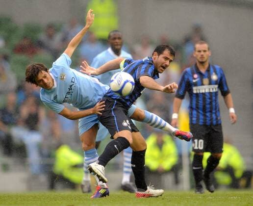 David Silva of Manchester City challenges Dejan Stankovic of Inter Milan Dublin Super Cup Internazionale v Manchester City 31st July, 2011 EDITORIAL USE ONLY. No use with unauthorised audio, video, data, fixture lists, club league logos or live services. Online in-match use limited to 120 images, no video emulation. No use in betting, games or single club league player publications.