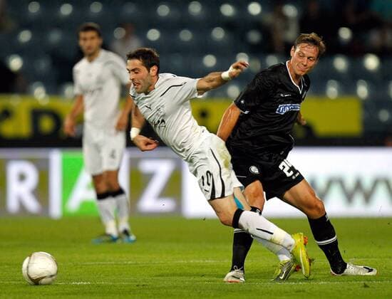 FUSSBALL - UEFA CL Quali, Sturm vs Zestafoni GRAZ,AUSTRIA,03.AUG.11 - FUSSBALL - UEFA Champions League, Qualifikation, SK Sturm Graz vs FC Zestafoni. Bild zeigt Irakli Dzaria (Zestafoni) und Roman Kienast (Sturm). 