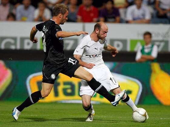 FUSSBALL - UEFA CL Quali, Sturm vs Zestafoni GRAZ,AUSTRIA,03.AUG.11 - FUSSBALL - UEFA Champions League, Qualifikation, SK Sturm Graz vs FC Zestafoni. Bild zeigt Martin Ehrenreich (Sturm) und Jaba Dvali (Zestafoni). 
