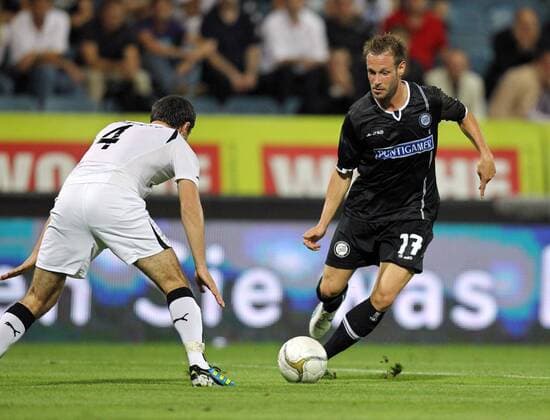 FUSSBALL - UEFA CL Quali, Sturm vs Zestafoni GRAZ,AUSTRIA,03.AUG.11 - FUSSBALL - UEFA Champions League, Qualifikation, SK Sturm Graz vs FC Zestafoni. Bild zeigt George Oniani (Zestafoni) und Martin Ehrenreich (Sturm). 