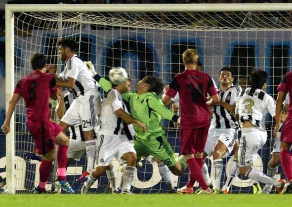 Belgrade - FK Partizan Belgrad - KRC Genk - Uefa champions league qualifying third leg - FK Partizan players Nemanja Rnic (2L), Nemanja Tomic (3L), Vladimir Stojkovic (4L) goalkeeper and Eduardo (second from right) try to protect own goal after indirect shoot of Daniel Tozser (L) KRC Genk - 