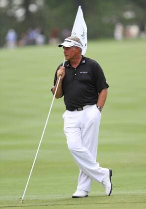 August 04 2011: Darren Clarke holding the flag after an Eagle during the World Golf Championships-Bridgestone Invitational first round of play at Firestone Country Club in Akron, OH. PGA Golf Herren AUG 04 WGC Bridgestone Invitational - First Round Icon1108041235 EDITORIAL USE ONLY