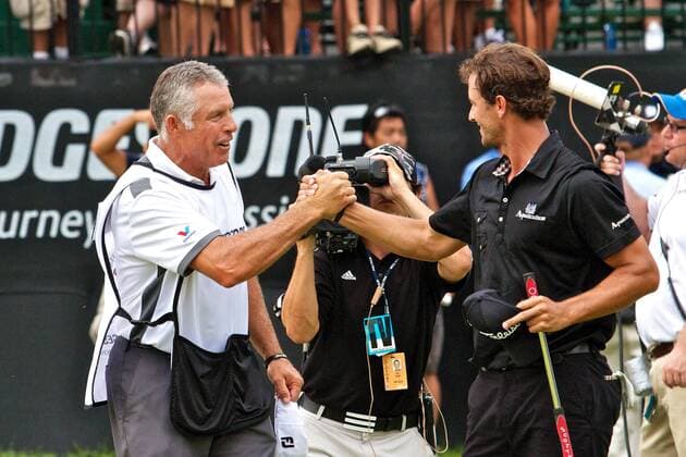 Aug. 7, 2011 - Akron, Ohio, U.S - Adam Scott, right, is congratulated by his caddie Steve Williams after the final round of the Bridgestone Invitational at Firestone Country Club, Akron, Oh. PGA Golf Herren 2011 - Aug 7 - Bridgestone Invitational - ZUMAx09