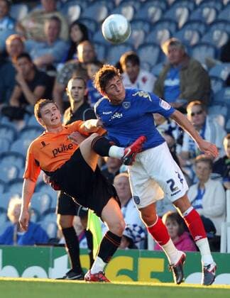 Football Carling Cup Round One - FC Portsmouth vs. Barnet FC, at Fratton Park: Portsmouth s Joel Ward battles with Barnet s Mark Byrne 09 08 2011 