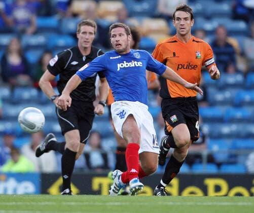 Football Carling Cup Round One - FC Portsmouth vs. Barnet FC, at Fratton Park: Portsmouth s David Norris battles with Barnet s Mark Hughes 09 08 2011 