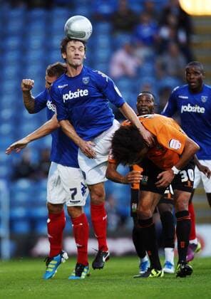 Football Carling Cup Round One - FC Portsmouth vs. Barnet FC, at Fratton Park: Portsmouth s Christian Dailly battles with Barnet s Jason Price 09 08 2011 