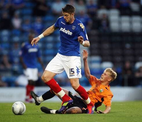 Football Carling Cup Round One - FC Portsmouth vs. Barnet FC, at Fratton Park: Portsmouth s Greg Halford battles with Barnet s Jordan Parkes 09 08 2011 