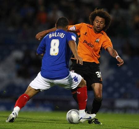 Football Carling Cup Round One - FC Portsmouth vs. Barnet FC, at Fratton Park: Portsmouth s Hayden Mullins battles with Barnet s Jason Price 09 08 2011 