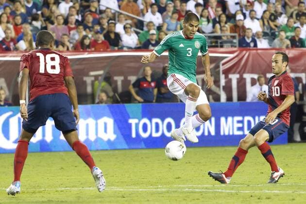 August 10, 2011: Mexico defender Carlos Salcido (3) leaping for the ball while in between USA forward Juan Agudelo (18) and forward Landon Donovan (10) during the international friendly match between the USA and Mexico at Lincoln Financial Field in Philadelphia, Pennsylvania. USA and Mexico tied 1-1. - ZUMAcs7