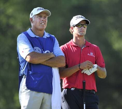 Adam Scott (R) and his caddie Steve Williams survey the 16th hole from the tee box during the first round of the 93rd PGA Golf Herren Championship at the Atlanta Athletic Club on August 11, 2011 in Johns Creek, Georgia.  BKX2011081107
