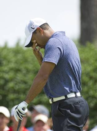 Tiger Woods rubs his eyes on the 7th tee during the second round of the 93rd PGA Golf Herren Championship at the Atlanta Athletic Club on August 12, 2011 in Johns Creek, Georgia.  BKX2011081255